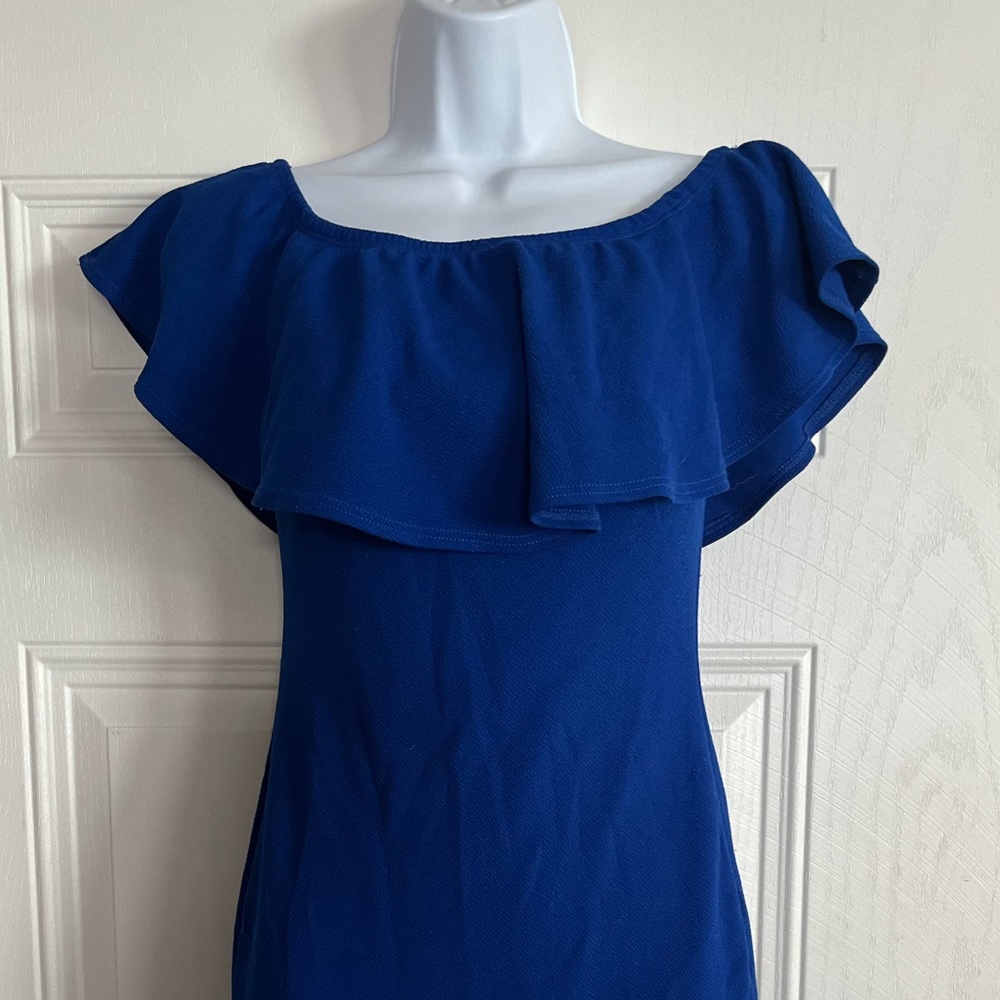 A royal blue ruffle top off the shoulder